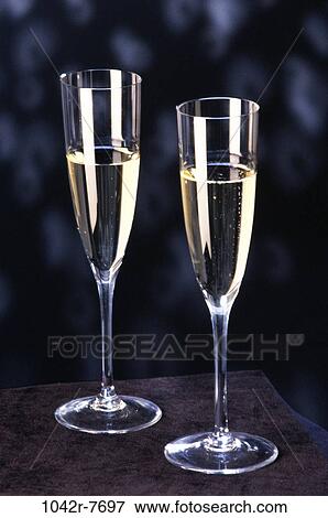 Stock Photo - Two champagne flutes. Fotosearch