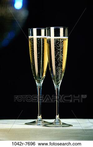 Stock Photograph - Two champagne flutes. Fotosearch