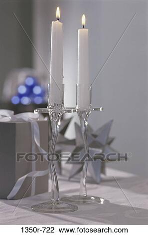 Two lit candles on candle stands View Large Photo Image Stock Image - Two lit candles on candle stands. Fotosearch