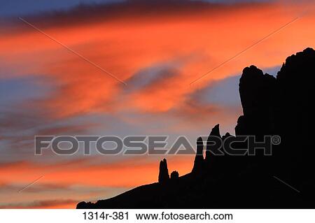 USA, Arizona, Apache Junction, Silhouette of Superstition Mountains against orange sky at sunset View Large Photo Image Stock Image - USA, Arizona, Apache Junction, Silhouette of Superstition Mountains against orange sky at sunset. Fotosearch