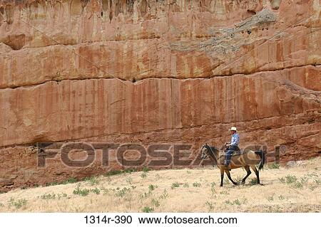 USA, Wyoming, Hyattville, Horseback rider along rock wall at Medicine Lodge State Archeological Park View Large Photo Image Stock Image - USA, Wyoming, Hyattville, Horseback rider along rock wall at Medicine Lodge State Archeological Park. Fotosearch