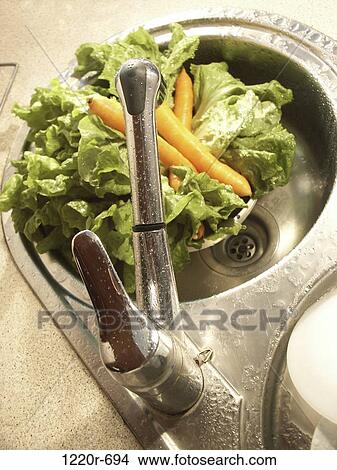 Picture - Vegetables in a sink. Fotosearch