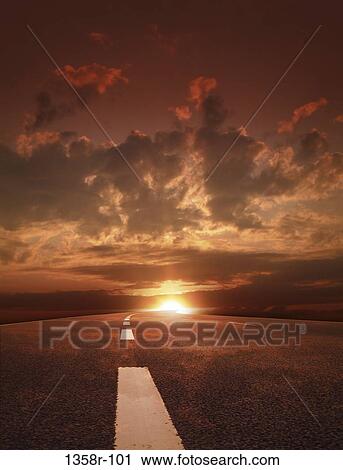 View of a road at sunset View Large Photo Image Stock Image - View of a road at sunset. Fotosearch