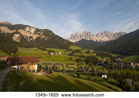 Village with mountain range in the background, Santa Maddalena, Funes Valley, Dolomites, Trentino-Alto-Adige, Italy View Large Photo Image Stock Photography - Village with mountain range in the background, Santa Maddalena, Funes Valley, Dolomites, Trentino-Alto-Adige, Italy. Fotosearch