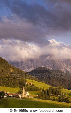 Village with mountain range on a landscape, Santa Maddalena, Funes Valley, Dolomites, Trentino-Alto-Adige, Italy View Large Photo Image Stock Image - Village with mountain range on a landscape, Santa Maddalena, Funes Valley, Dolomites, Trentino-Alto-Adige, Italy. Fotosearch