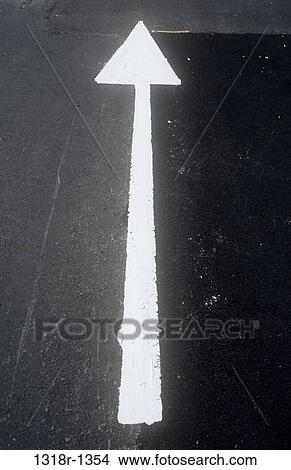 White arrow sign painted on tarmac road surface View Large Photo Image Picture - White arrow sign painted on tarmac road surface. Fotosearch