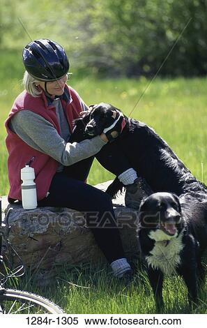 Woman with two dogs View Large Photo Image Stock Photography - Woman with two dogs. Fotosearch