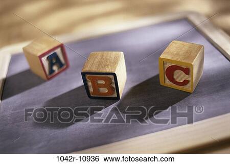 Wooden alphabet blocks on a chalkboard View Large Photo Image Stock Photograph - Wooden alphabet blocks on a chalkboard. Fotosearch