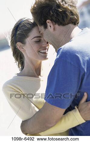 Stock Image - Young couple hugging each other. Fotosearch