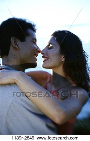 Young couple hugging each other View Large Photo Image Stock Photo - Young couple hugging each other. Fotosearch