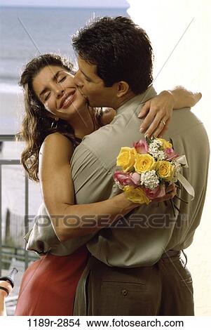 Picture - Young couple hugging. Fotosearch