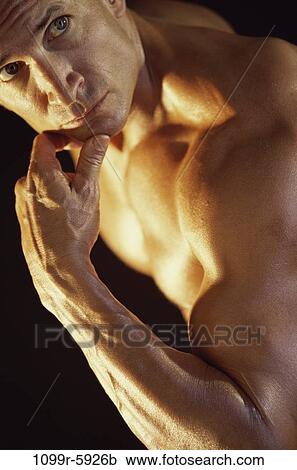 Young man with his hand on his chin View Large Photo Image Stock Image - Young man with his hand on his chin. Fotosearch