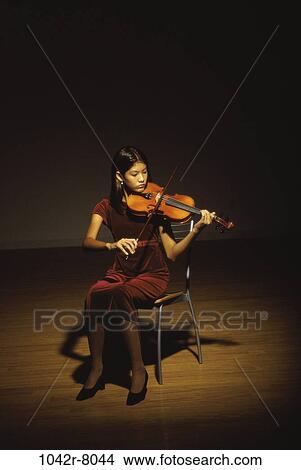 Young woman playing the violin View Large Photo Image Picture - Young woman playing the violin. Fotosearch