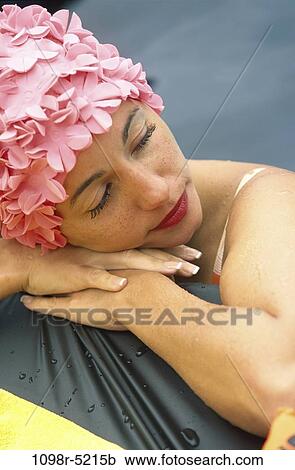 Stock Image - Young woman relaxing. Fotosearch