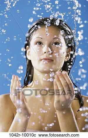 Young woman taking a shower View Large Photo Image Stock Image - Young woman taking a shower. Fotosearch