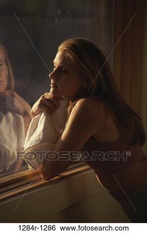 Stock Photograph - Young woman thinking. Fotosearch