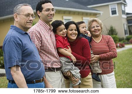 A 3 generation Hispanic family posing in backyard View Large Photo Image Stock Photo - A 3 generation Hispanic family posing in backyard. Fotosearch