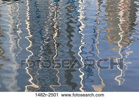 Stock Image - Abstract reflections of sailboats in water, Seaport Village, San Diego, California, USA. Fotosearch