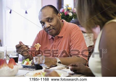 African American couple eating at home View Large Photo Image Stock Photo - African American couple eating at home. Fotosearch