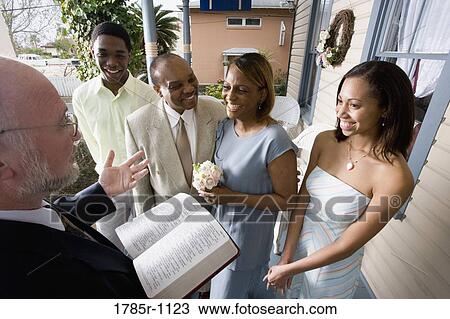 Stock Image - African American couple renewing vows. Fotosearch