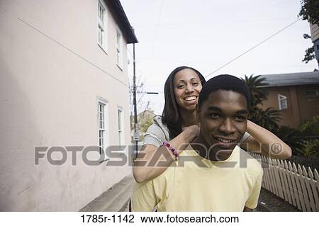 Stock Image - African American teenagers outside. Fotosearch