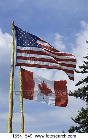 Stock Photo - American flag and the Canadian flag. Fotosearch