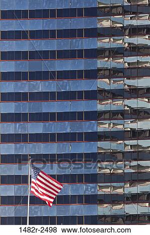 Stock Photo - American flag in front of a hotel, Marriott Hotel, San Diego, California, USA. Fotosearch