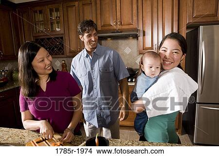 Asian-Caucasian family in kitchen View Large Photo Image Picture - Asian-Caucasian family in kitchen. Fotosearch