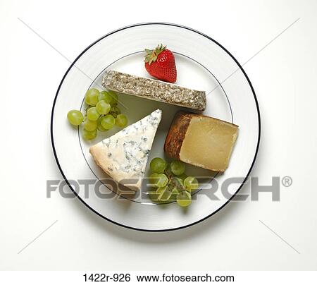 Stock Photograph - Assorted cheeses garnished with green grapes and strawberry. Fotosearch