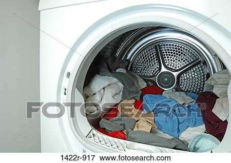 Assorted clothing inside laundry tumble dryer View Large Photo Image Stock Photo - Assorted clothing inside laundry tumble dryer. Fotosearch