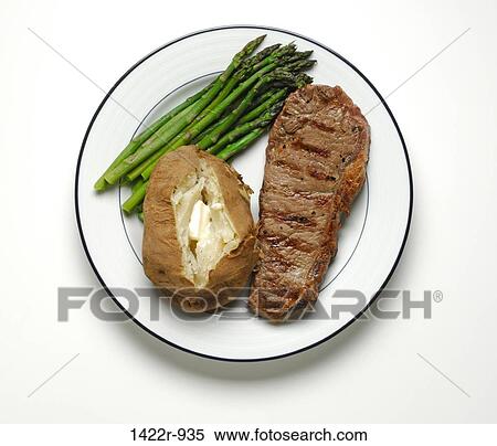 Stock Photography - Beef steak, baked potato and asparagus on plate. Fotosearch