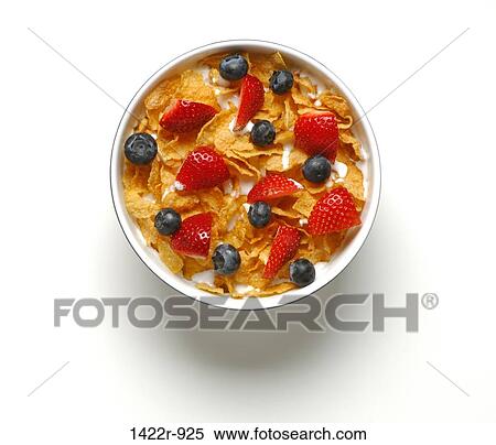 Stock Photography - Bowl of breakfast cereal with blueberries and strawberries. Fotosearch