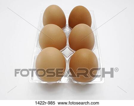 Stock Photography - Brown eggs in a plastic carton. Fotosearch