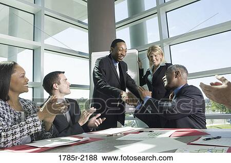 Business colleagues applauding in a meeting View Large Photo Image Stock Photo - Business colleagues applauding in a meeting. Fotosearch
