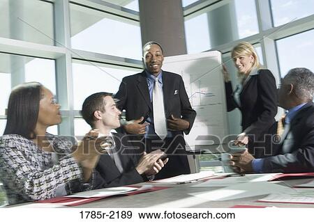Business colleagues applauding in a meeting View Large Photo Image Stock Photo - Business colleagues applauding in a meeting. Fotosearch