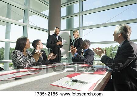 Business colleagues applauding in a meeting View Large Photo Image Stock Photography - Business colleagues applauding in a meeting. Fotosearch