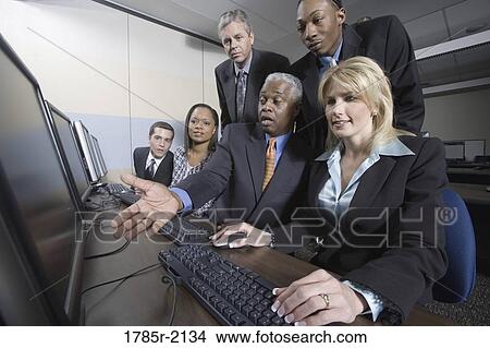 Business colleagues at a computer training seminar View Large Photo Image Picture - Business colleagues at a computer training seminar. Fotosearch