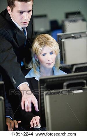 Business colleagues at a computer training seminar View Large Photo Image Picture - Business colleagues at a computer training seminar. Fotosearch