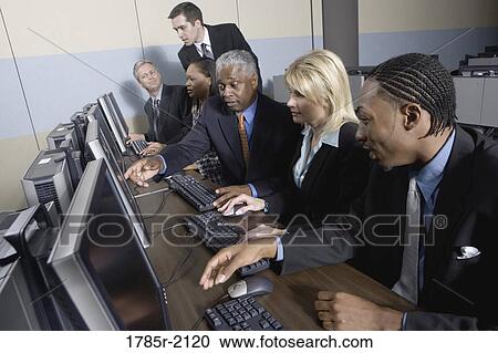 Business colleagues at a computer training seminar View Large Photo Image Stock Image - Business colleagues at a computer training seminar. Fotosearch