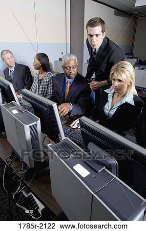 Business colleagues at a computer training seminar View Large Photo Image Stock Image - Business colleagues at a computer training seminar. Fotosearch