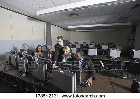 Business colleagues at a computer training seminar View Large Photo Image Stock Image - Business colleagues at a computer training seminar. Fotosearch