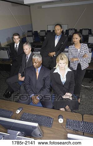 Business colleagues at a computer training seminar View Large Photo Image Stock Image - Business colleagues at a computer training seminar. Fotosearch