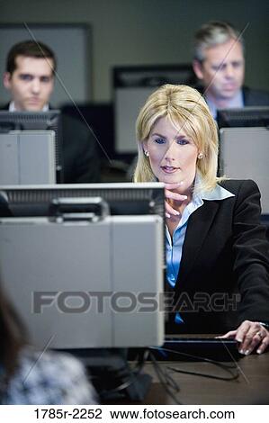Business colleagues at a computer training seminar View Large Photo Image Stock Image - Business colleagues at a computer training seminar. Fotosearch