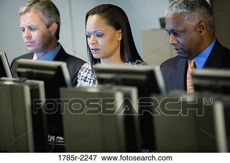 Business colleagues at a computer training seminar View Large Photo Image Stock Photo - Business colleagues at a computer training seminar. Fotosearch
