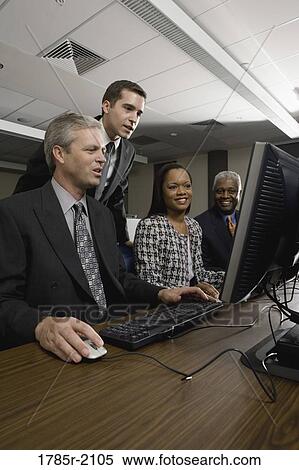 Business colleagues at a computer training seminar View Large Photo Image Stock Photography - Business colleagues at a computer training seminar. Fotosearch