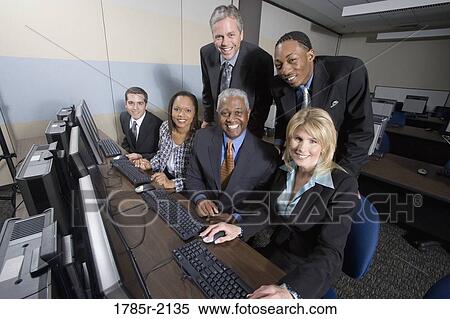 Business colleagues at a computer training seminar View Large Photo Image Stock Photography - Business colleagues at a computer training seminar. Fotosearch