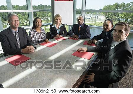 Stock Image - Business colleagues in a meeting. Fotosearch