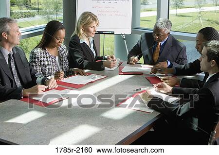 Business colleagues in a meeting View Large Photo Image Stock Image - Business colleagues in a meeting. Fotosearch