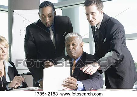 Business colleagues in a meeting View Large Photo Image Stock Image - Business colleagues in a meeting. Fotosearch