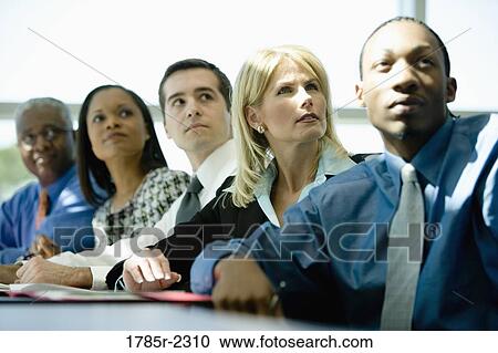 Business colleagues in a meeting View Large Photo Image Stock Image - Business colleagues in a meeting. Fotosearch